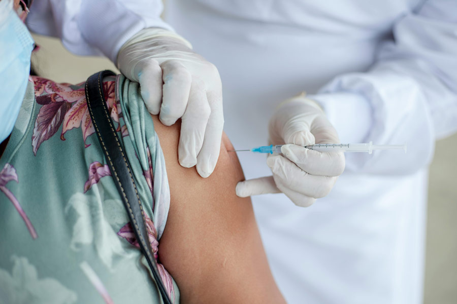 Nurse giving a patient a vaccine