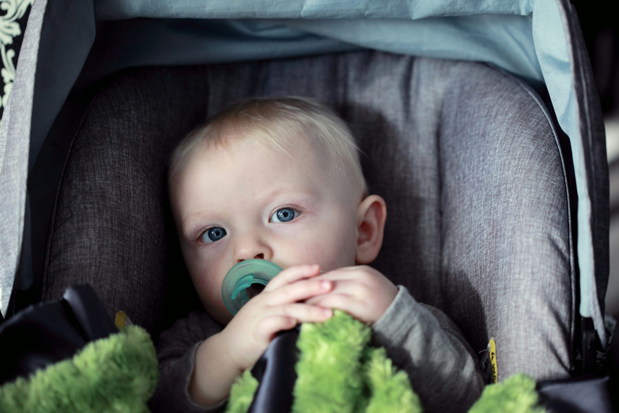 Child strapped in carseat
