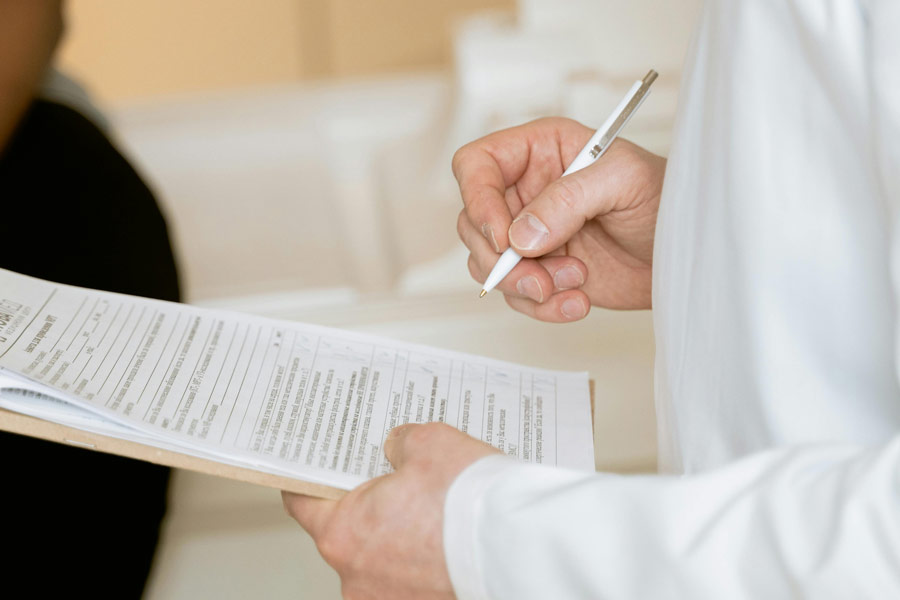 Nurse filling out a form.
