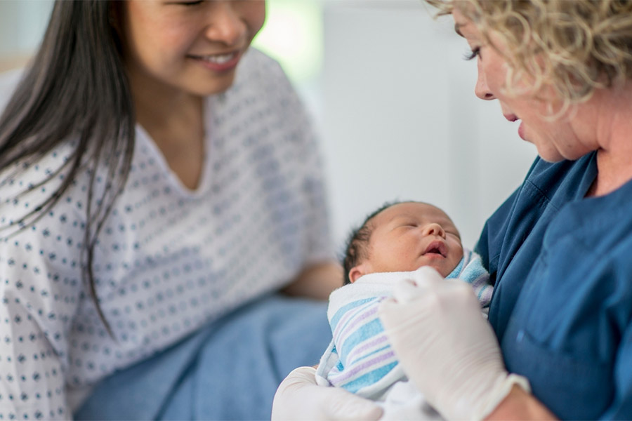Healthcare provider holding infant
