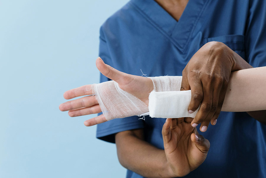Nurse wrapping a patient's wrist