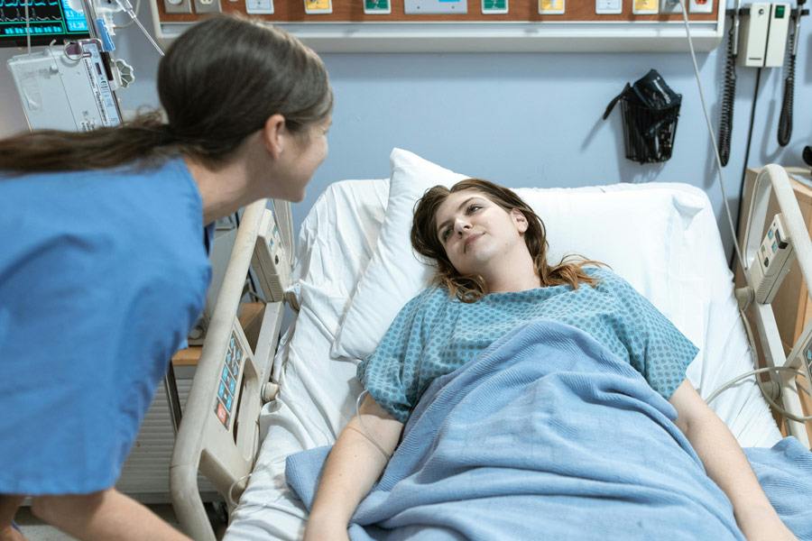 Emergency care patient speaking with nurse
