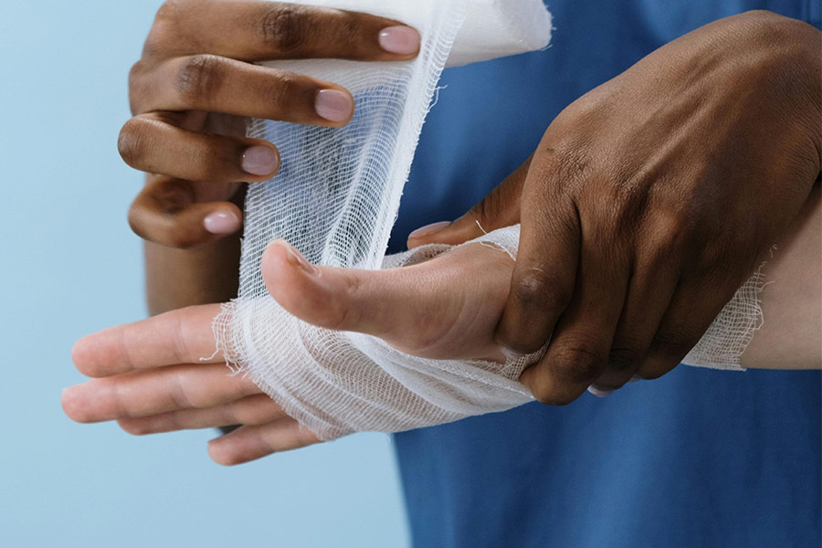 Nurse applying bandages to patient